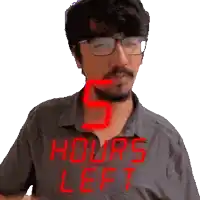 a man wearing glasses and a shirt that reads 5 hours left