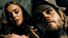 a man with a beard and a woman with tears in her eyes
