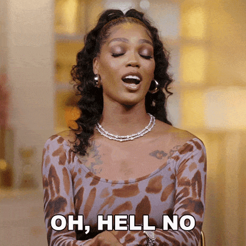 a woman in a leopard print top says 
