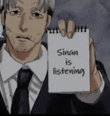 a man in a suit and tie holds a notepad that says sinan is listening