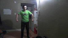 a man wearing a green shirt that says minecraft