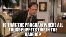 a man in a suit and tie is sitting at a desk with a caption that says is that the program where