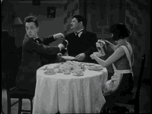Laurel Hardy GIF - Laurel Hardy Table GIFs