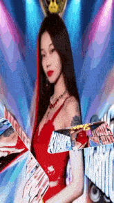 a woman in a red dress stands in front of a sign that says ' harmony '