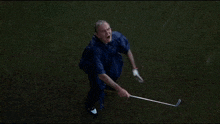 a man in a blue cape is holding a golf club and says " rat farts " in yellow letters