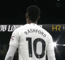 a soccer player named rashford wears a white jersey with the number 10 on it