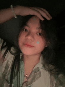 a girl with a necklace that says ' i love you '