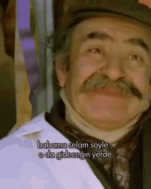 a man with a mustache is smiling and says babama selam soyle o da gideceğin yerde