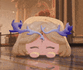 a cartoon character with antlers on her head laying on the floor