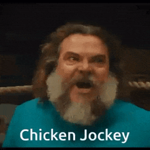a man with a beard and long hair is making a funny face and says `` chicken jockey '' .