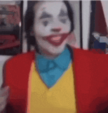 a close up of a person dressed as the joker with a red jacket and yellow vest .