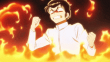 a man in a white shirt is standing in front of a fire