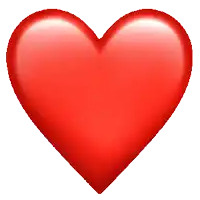 a red heart on a white background with a blurred background