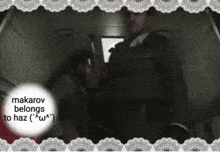 a man in a suit and tie is standing in a dark room with the words " makarov belongs haz " in the corner