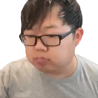 a person wearing glasses and a grey shirt