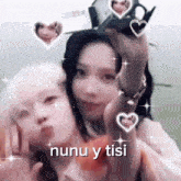 a couple of girls are taking a selfie with the words nunu y tisi written on the bottom .