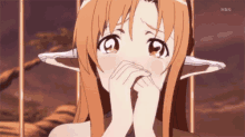 a girl with elf ears covering her face with her hands