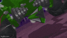 a black and blue racing car is driving down a road .