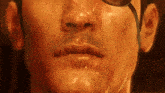 a close up of a man 's face with a ladle in his mouth