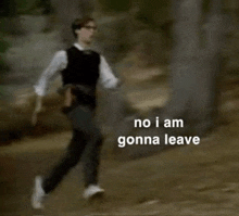 a man is running in the woods with the words `` no i am gonna leave '' written above him .