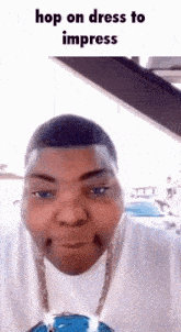 a man is wearing a white shirt and a chain around his neck and the caption says " hop on dress to impress "