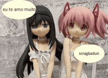 two anime figures are sitting next to each other with a speech bubble that says eu te amo muito