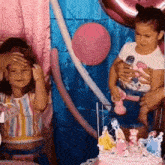 a little girl is cutting a birthday cake with a princess on it .