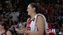 a female basketball player wearing a jersey that says washington
