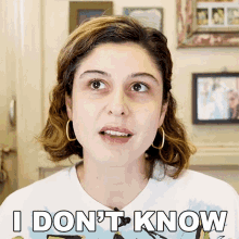 a woman in a white shirt says " i don t know "