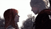 a man and a woman are looking into each other 's eyes in a video game .