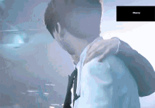 a man is hugging another man and the word cherry is on the corner