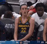 a female basketball player wearing a jersey with the number 22 on it
