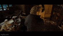 a man in a black coat says " and yes " in white letters