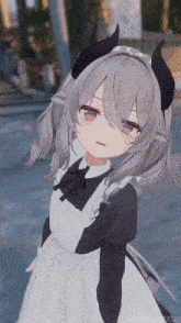 a girl with horns on her head and a maid outfit