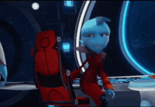 a cartoon character with blue skin and a red jacket is standing in front of a window .