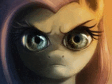 a close up of a pony 's face with an angry expression .