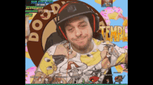 a man wearing a hat and headphones is playing a video game called temple