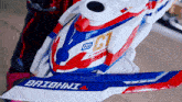 a red white and blue toy with the word baiohni on the bottom
