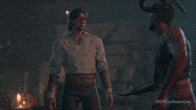 a man with horns is standing next to another man with horns