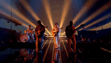 a group of men are playing instruments on stage
