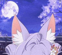 a cat with a full moon in the background