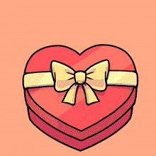 a red heart shaped box with a yellow bow and the word surprise written above it