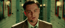a man in a suit and tie has a bandage on his face