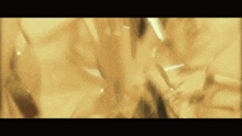 a close up of a gold colored background