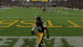 a pittsburgh steelers football player kneeling on the field