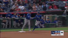 a blue jays player runs to first base