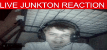 a boy wearing headphones with the words live junkton reaction written above him