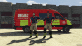 two men are standing in front of a red and yellow van that says lfb