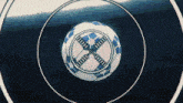 a blue and white soccer ball is surrounded by circles with the letters hh on them
