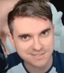 a close up of a man 's face looking at the camera .